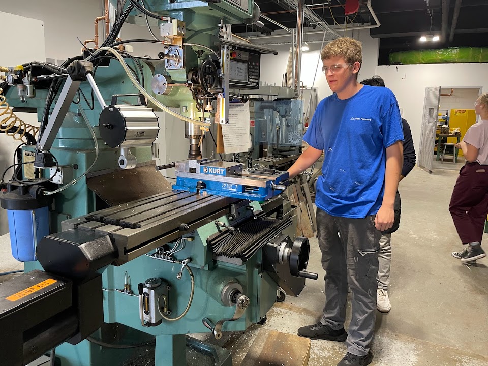 Image of me using the manual milling machine to face cube